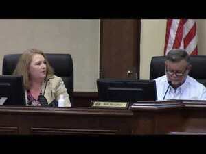 [County Manager Paige Dukes, County Chairman Bill Slaughter]